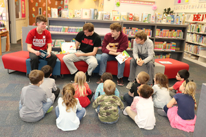 Boys Basketball Juniors/Seniors Read to MES Students