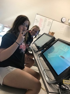 Emma Shroeder and Jordan Wheeler working with the 3D computers.